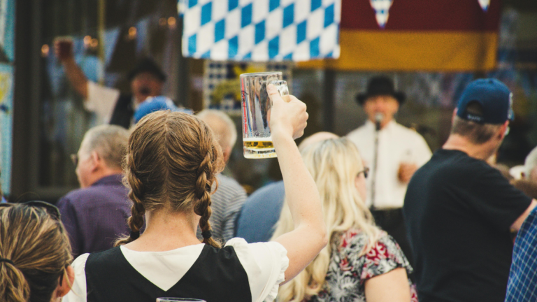 A girl holding a vine glass in a party
